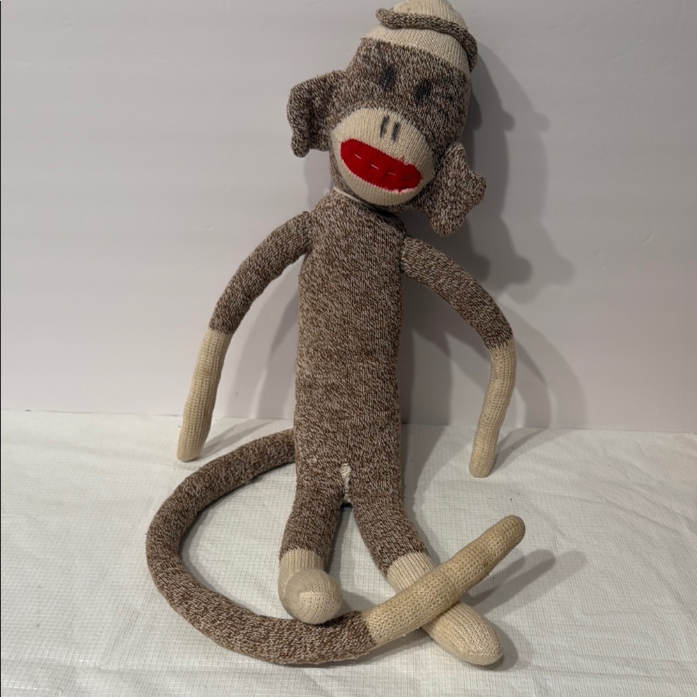 Brown and Tan Decor Accent Sock Monkey a Classic Stuffed Toy with a rich history